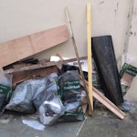 Assorted building waste Timber and foam insulation from roofing works. SE16 - removed for £95