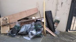 Assorted building waste Timber and foam insulation from roofing works. SE16 - removed for £95