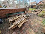 Wooden jungle gym with slide Dismantled wooden jungle gym, slide and metal pole, already cut into pieces 1 person can carry. Stacked in back garden, but easy access through side passage to right of garage on good concrete path KT10 - removed for £200