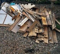 wood and metal water tank collected by Redcastle Services
