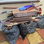 wood fence and cleaning tools x 5 black bags of broken down wood fencing. Lose broken down wood door. Vileda cleaning poles. NW2 - removed for £86