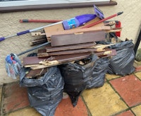 wood fence and cleaning tools collected by fortknox waste