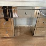 mirrored desk with draws a mirrored desk with draws, it’s quite heavy, bottom right draw handle is off and mirror cracked but could still be used /repaired E11 - removed for £91