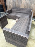 Garden furniture Lshaped L shaped outdoor rattan sofa splits into 2. Table with glass top and foot stools as per photo TW7 - removed for £71