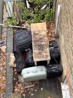 kitchen table and 9 suitcases collected by M&V waste Clearance