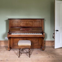 tuned piano and stool collected by Rid Junk Ltd