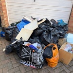 Room clearance. Room clearance. paper, textiles, pillows, blanket, bags, small electricals, a few small panes of glass separated from the rest. mostly packed in black sacks. In front of garage door down driveway. TW5 - removed for £104