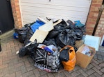 Room clearance. Room clearance. paper, textiles, pillows, blanket, bags, small electricals, a few small panes of glass separated from the rest. mostly packed in black sacks. In front of garage door down driveway. TW5 - removed for £104