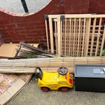 assorted bric a brac the brown garden bin is full of household waste in black bags (not food, bric a brac) also everything else out front including some garden bric a brac, a safe, safety gate and old toys and books. please remember to empty the brown bin! Just can’t leave black bags out as foxes get them N8 - removed for £76