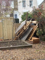 An old bin shed of wood collected by Squeaky Clean Removals