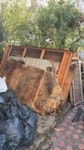 broken down shed and old bench broken down shed with 5 large panels (sides and floor), then bags of torn off roof felt and cut down joists. Also some panels of OSB from roof and a broken down old bench. All parts easy to grip to lift but panels large enough to be two person job. rubble bags filled with cut down wood and various screws from demo job. N4 - removed for £380