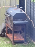 a large BBQ and small fountain It is a large BBQ and a small white fountain as the photos shows attached NW7 - removed for £78