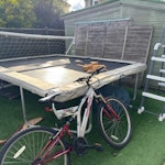 unwanted garden items trampoline (we are unable to break this down) , plastic pool plus ladder, bike, fence panels and random wood, kids goal. KT15 - removed for £200