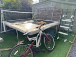 unwanted garden items trampoline (we are unable to break this down) , plastic pool plus ladder, bike, fence panels and random wood, kids goal. KT15 - removed for £200