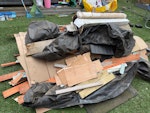 Disassembled wooden shed Disassembled wooden shed with associated materials, timber panels, boards, membrane sheeting, cardboard, and a few sections of artificial grass (rolled). One builder’s bag already filled with mixed items. All in the back garden. TW13 - removed for £296