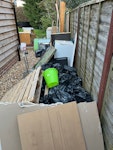 rubble bags, kitchen cabinets kitchen cabinets and wooden work top, rubble bags with plasterboard / some tiles, microwave, waist height fridge and freezer, oven, garden hose RH6 - removed for £300