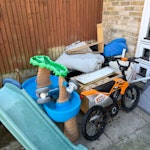 garden toys/ rubbish/ wheelbar mixed rubbish from the garden. garden toys, small kids bike, wheelbarrow. NW10 - removed for £117