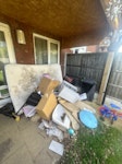 Mix of junk It includes
A mattress
Old suitcase
Old sink
Under sink cupboard 
Lots of cardboard
Broken pieces of wood 
See photos B28 - removed for £250