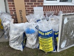 Builder waste 22 bags of tiles and plaster board debris , tall cabinet 2 bathroom cabinet and shower screen , toilet bowl and small wash basin BR3 - removed for £156