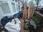 28 bags+wood/tree stump/astro c28 bin bags (most soil, some wood, some general waste, some green waste); 2 x folding garden chairs; tree stump (needs two to lift); a few rolls of artificial grass; planks of wood from dismantled garden shed and dismantled rotten corner planter; small branches from tree. SW13 - removed for £357