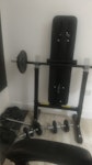 Home gym equipment 1 foldable bench press (can be taken apart if needed), 1 barbell, 2 dumbbells and free weights ranging from 0.5 to 10kg IG9 - removed for £68