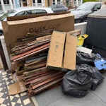 Wood, cardboard boxes, sacks Old wooden fencing, some bags of rubble and building waste. Also a few cardboard boxes (one large one). SE4 - removed for £130