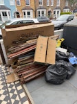 Wood, cardboard boxes, sacks Old wooden fencing, some bags of rubble and building waste. Also a few cardboard boxes (one large one). SE4 - removed for £130