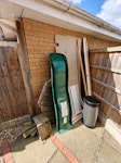 DIY waste and climbing frame Some plasterboard, wood waste and an old plastic bin. Disassembled climbing frame wooden parts and plastic slide NG2 - removed for £91