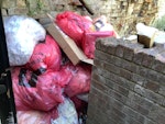 Rubbish removal Build-up of rubbish bags and cardboard LU1 - removed for £177