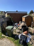 Mixed Garden Waste Clearance Back garden clearance, approx 1–1.5 van loads. Mixed waste: black bags (rubble/general), plastic plant pots, timber/pallets, broken tools. Some items to be left in place (bricks, york stone slabs). SE27 - removed for £429