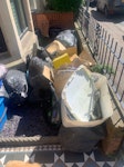 Mixed household rubbish. NOT THE TWO BLUE PLANT HOLDERS THOSE ARE TO STAY HERE THEYRE NOT RUBBISH

Mixed household waste (black bags). Also couple of hoovers and a few Cardboard boxes of rubbish. The white box at front contains water logged cat litter. CF11 - removed for £175