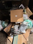 house hold rubbish and boxes empty cardboard boxes, old footstool, dismantled desk, old rug, bags of old toys SO23 - removed for £166