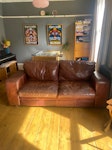 Leather sofa. Leather sofa. Fire label. Small professional repair to one cushion cover so rejected by charity shop. Looks worn but in a characterful way. Cushion foam could do with improving/renewing but overall pretty good. BN1 - removed for £71