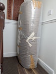 Household waste items Futon mattress (packaged up), bag of gysum, plant hanging frame, cupboard doors x 7, wooden offcuts, slatted wood piece. NW6 - removed for £86