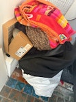 Textiles/pots/luggage etc 5 or so bags of textile recycling. An old suitcase, old pots, pans & chopping boards. A broken old fan, dead plant & pot. Empty dried tins. Old mdf cupboard doors 

My flat is on the top (third floor without lift access) SE5 - removed for £130