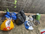Household and garden One bag of fabrics (old clothes and child sleeping bag inserts). One bag of garden waste. Bag containing old shoes, 2 small electrical items and broken charger, old monitor stand and car mirror. Plastic bag containing old catheters. A few fabric bags. W4 - removed for £71