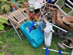 Garden stuff and furniture Wooden poles, tables, shelving unit, swingball, bin, bike, toolbox, oil heater, lamp,small ladder GU16 - removed for £286