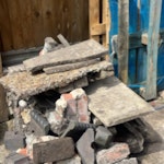 concrete, bricks and slabs large concrete blocks with bricks, paving slabs. TW20 - removed for £84