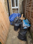 ~40sqm carpet and underlay Approx 40sqm carpet and underlay, plus 7no bin bags of scraps from having the floorboards restored, so pine board offcuts and then some waste empty bottles of varnish and general rubbish. E10 - removed for £137