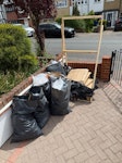 6 waste bags and wooden pallet Minor builders waste, cardboard, bits of copper pipe, cardboard boxes and wooden pallet IG9 - removed for £117