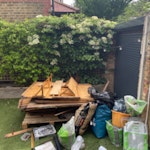Old shed, bags of gravel, junk Old shed, some random junk, bags of gravel, a slab of concrete, random pieces of wood TW11 - removed for £182