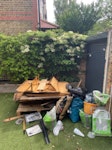 Old shed, bags of gravel, junk Old shed, some random junk, bags of gravel, a slab of concrete, random pieces of wood TW11 - removed for £182