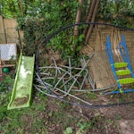 trampoline parts, slide & wood A dismantled trampoline, kids slide a table and some wood from a shed. Some general garden waste UB1 - removed for £117