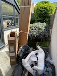 Household rubbish & cardboard 5 or 6 bin bags, some cardboard, some old bits of wood and some plastic wrapping. None very heavy just won’t fit in normal bins. cardboard box and wooden post are quite long - won’t fit in a small car. Does not include plant pot! M27 - removed for £57