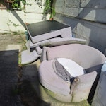 Large items in back garden Large corner sofa and cushions, swivel chair, large pet cage, tumble dryer, table and a bit of garden waste PR25 - removed for £204