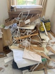 Builder waste Cartons and boxes from kitchen delivery. 
Left over engineered wood from floor making. 
Some junk from removal of old floor and carpets N1 - removed for £214