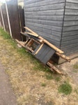 Old deck boards / wood. Several old decking boards and pieces of wood from garden renovation. Some cardboard boxes and a broken kids scooter. TW3 - removed for £117