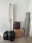 Furniture and clothing 1 Sofa, 2 small chests of drawers, 2 footstools, 1 upholstered blanket box, 1 cd shelf, 1 rug, 2 boxes of shoes, 3 bags of clothes W1 - removed for £273