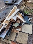 mixed wood, laminate, metal Laminate flooring, skirting boards, old ikea furniture (disassembled) mirrors, misc wood and metal. Does not include nearby paving slabs! NR3 - removed for £130
