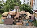 carpet, shelves, cardboard box old carpet, underlay, 2 x Chipboard shelving units, glass shower screen, old suitcase, old suitcase, cardboard boxes SE12 - removed for £350